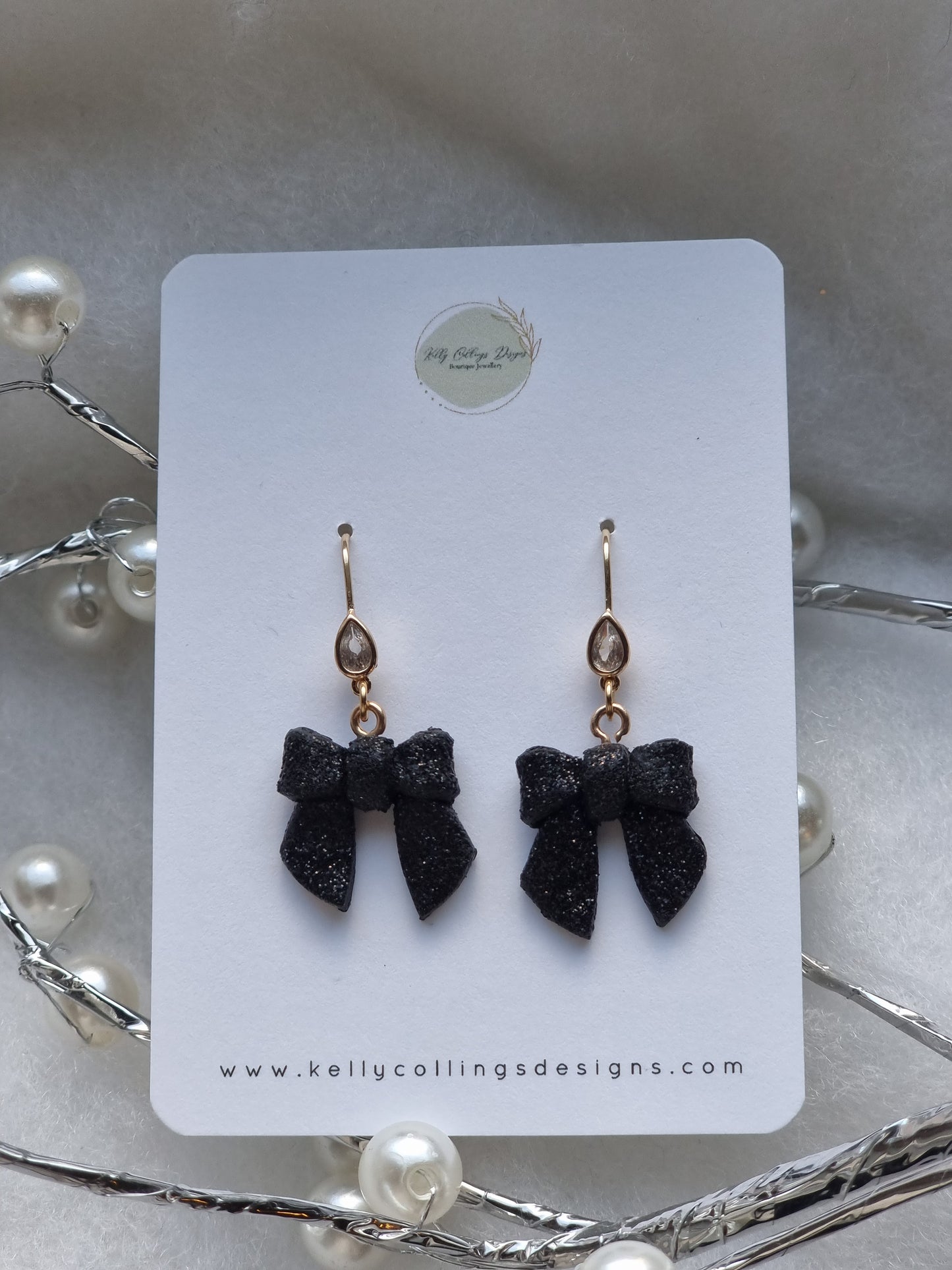Bow dangles black glitter