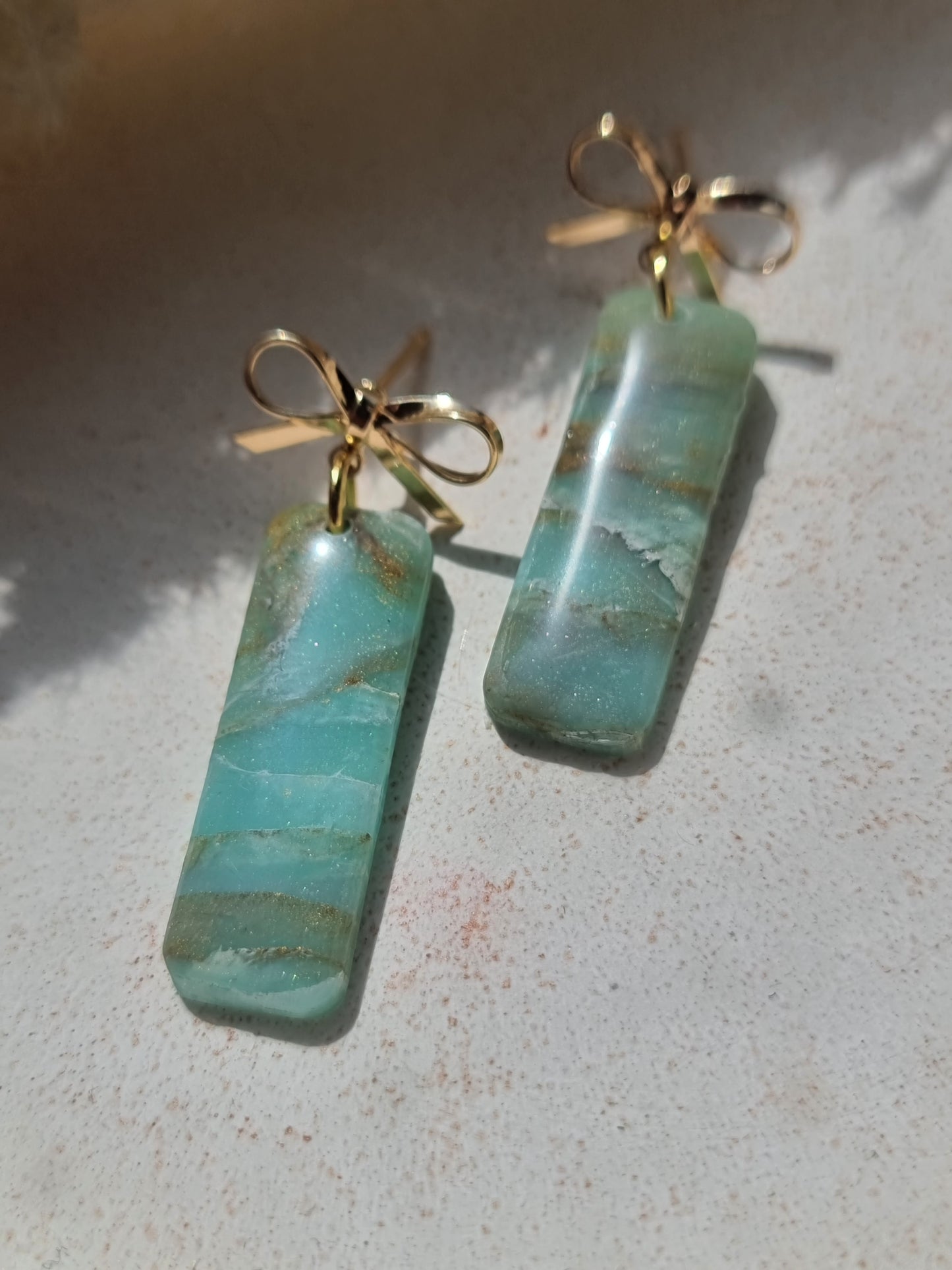 Turquoise rectangle bow top dangles