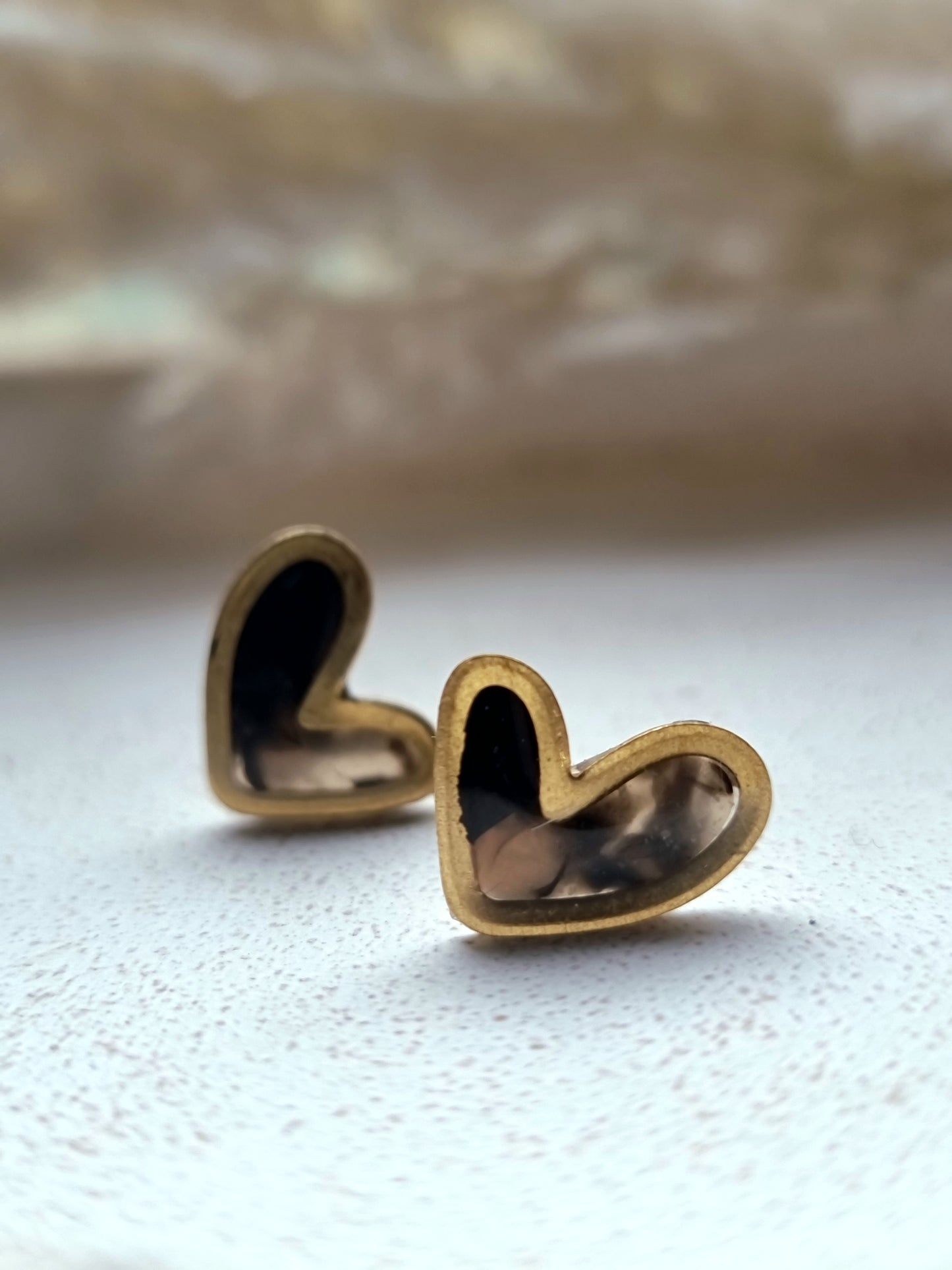 Gold trim heart studs