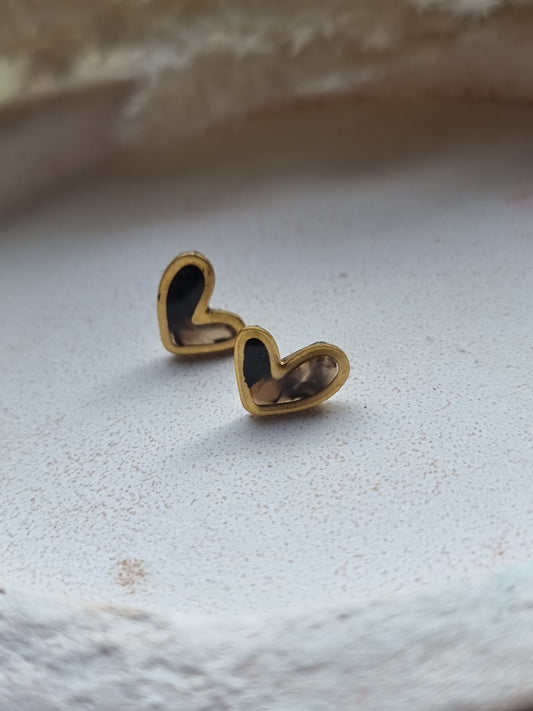 Gold trim heart studs