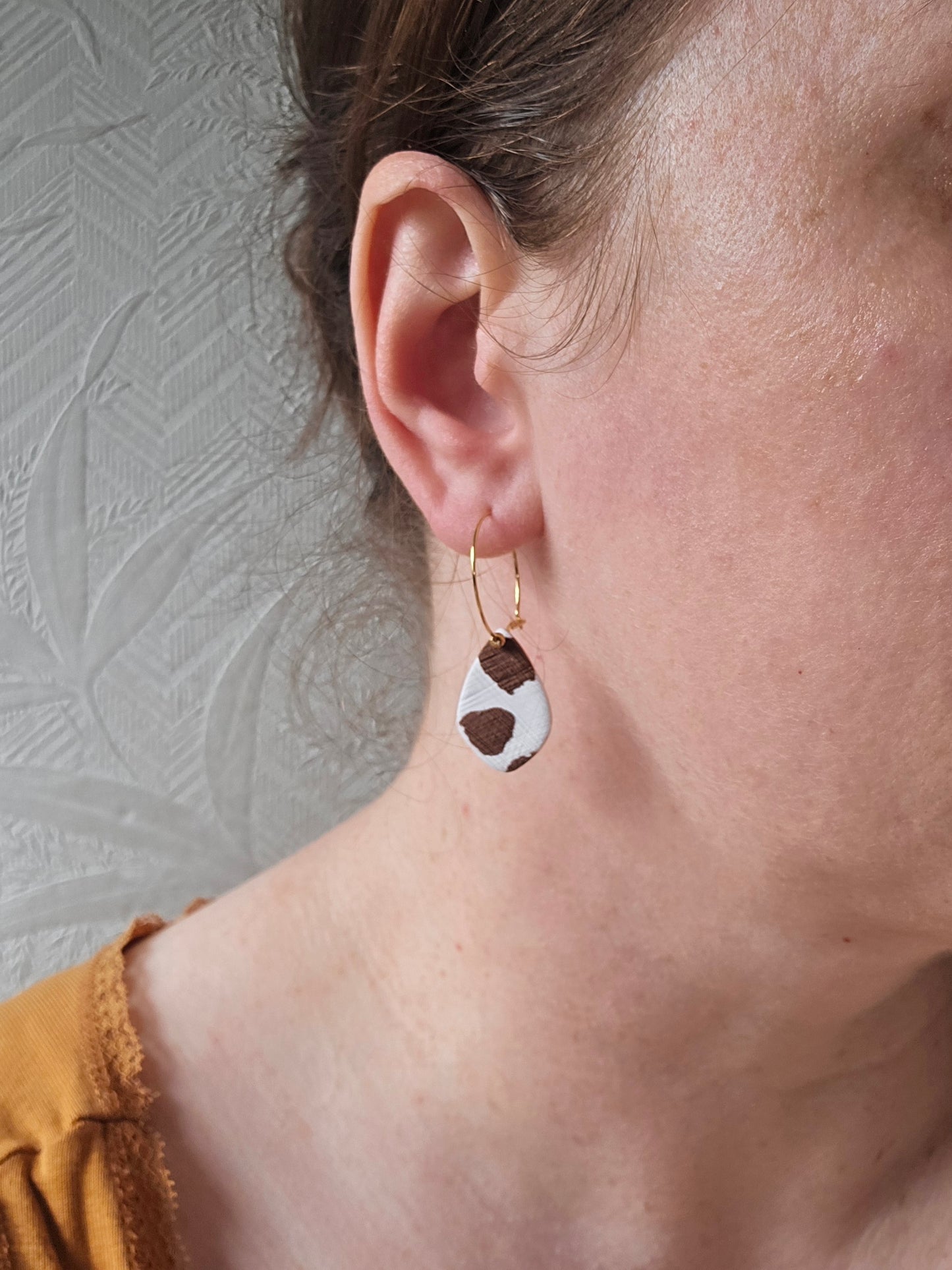 Cow print denim hoops