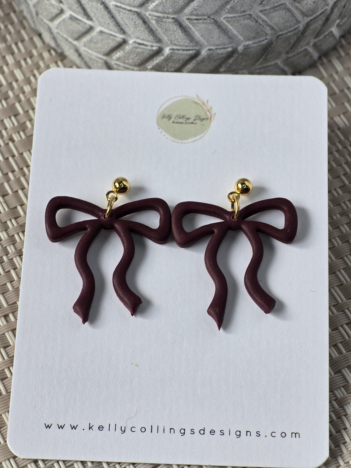 Bow dangles-wine