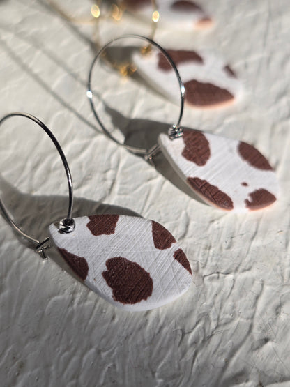 Cow print denim hoops