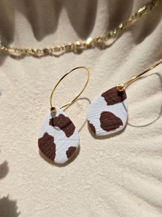 Cow print denim hoops