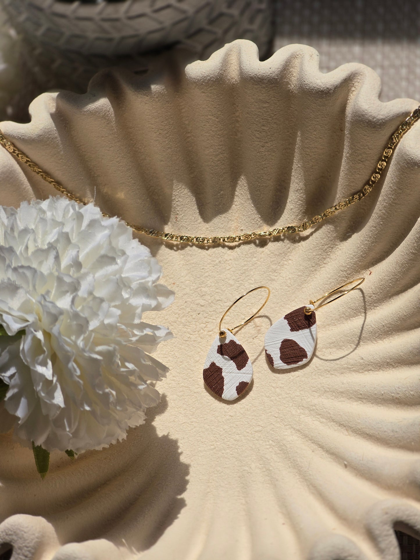 Cow print denim hoops
