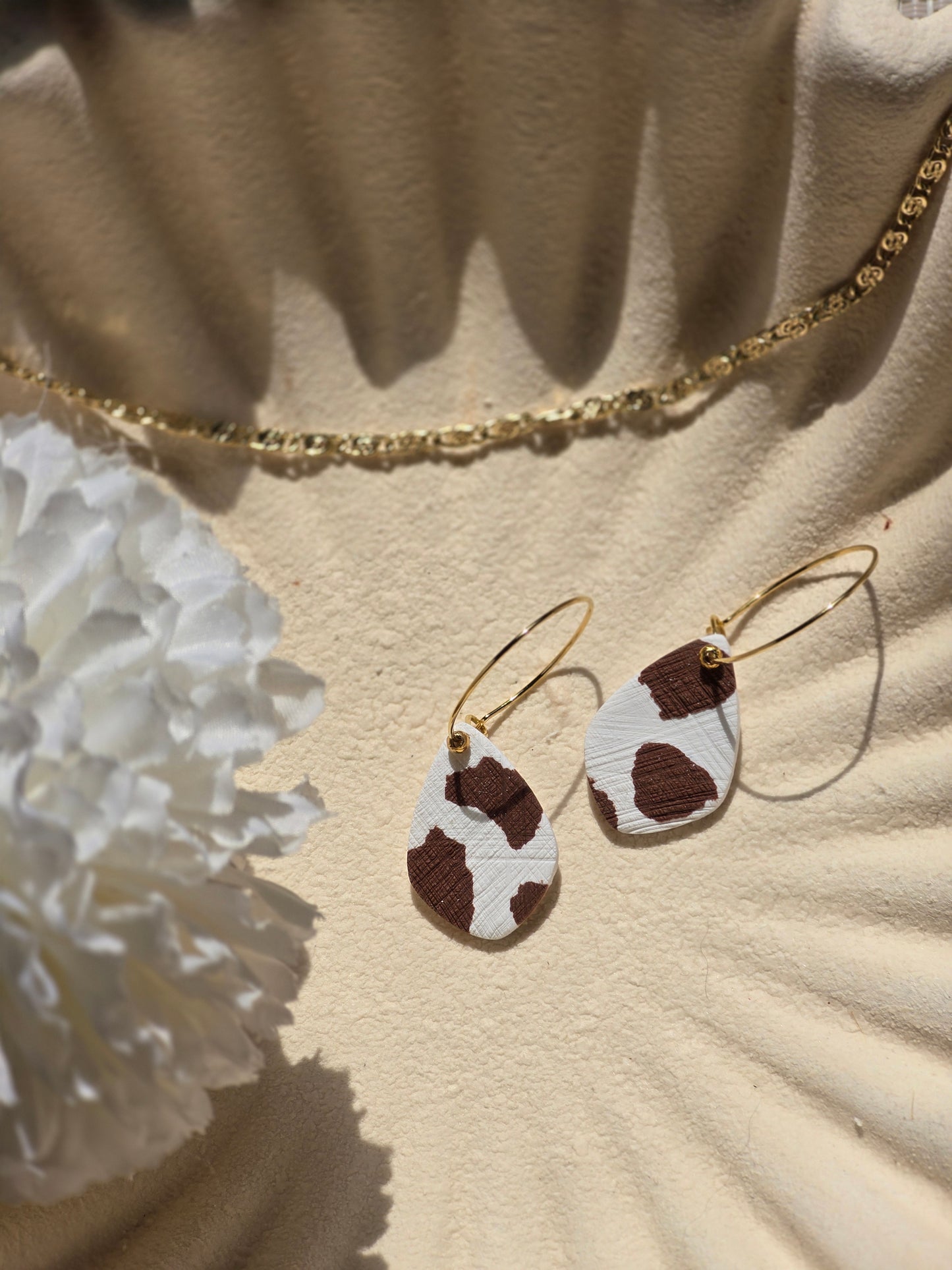 Cow print denim hoops