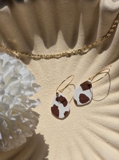 Cow print denim hoops