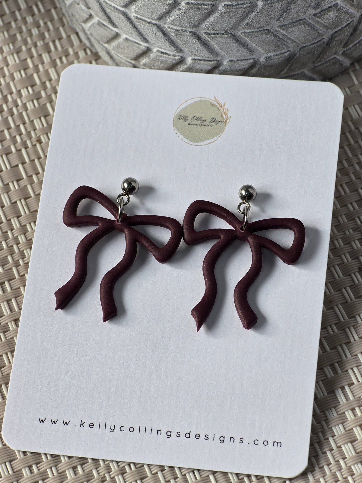 Bow dangles-wine